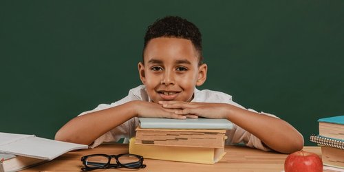 school-boy-resting-his-head-books_23-2148764014